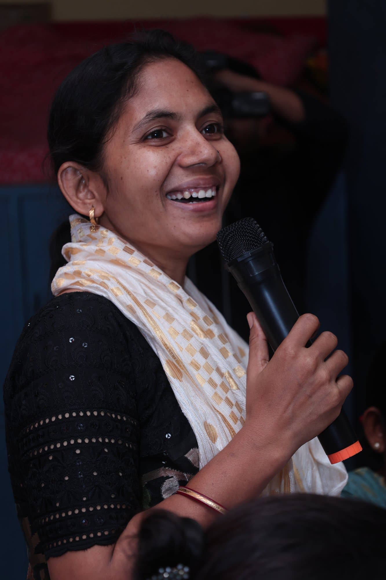A participant speaks into the microphone